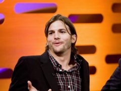 Ashton Kutcher and Mila Kunis have poked fun at the controversy surrounding their announcement they do not bathe their children every day (John Phillips/PA)