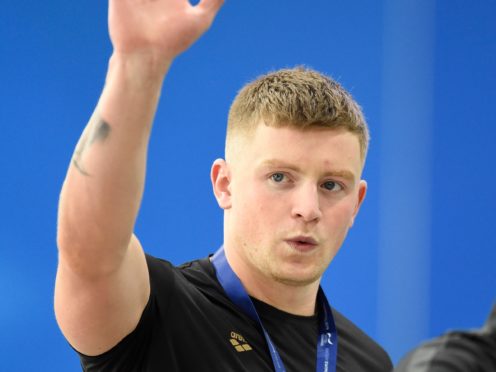 Adam Peaty swapped his gold medals for a gold dress in a cheeky snap from his Strictly preparation (Ian Rutherford/PA)