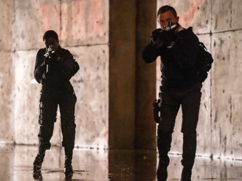 Daniel Craig playing James Bond and Lashana Lynch playing Nomi (Nicola Dove/Danjaq, LLC/MGM)
