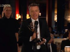 The Crown creator Peter Morgan received an Emmy Award for the regal drama in what was an historic moment for Netflix (Television Academy via AP)