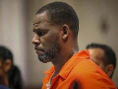 Former singing star R Kelly is to face trial over child porn charges after his sentencing for sex trafficking (Antonio Perez/Chicago Tribune via AP)