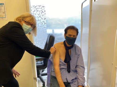 Shakin’ Stevens said he feels ‘100% better’ after having his coronavirus booster jab at McParland Pharmacy in Maidenhead, Berkshire (PA)