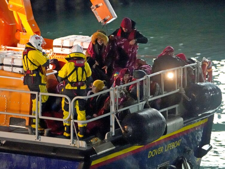 A group of people thought to be migrants are brought in to Dover, Kent, by the RNLI (Gareth Fuller/PA)