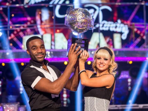 Joanne Clifton and Ore Oduba with the glitterball trophy (BBC/PA)