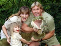 Bindi Irwin at the age of four, with her mother Terri and father Steve (Myung Jung Kim/PA)
