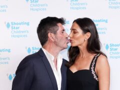 Simon Cowell and Lauren Silverman share a kiss as they arrive for the annual Shooting Star Ball in aid of leading children’s hospice charity Shooting Star Children’s Hospices, at the Royal Lancaster, in London. Picture date: Friday November 12, 2021.