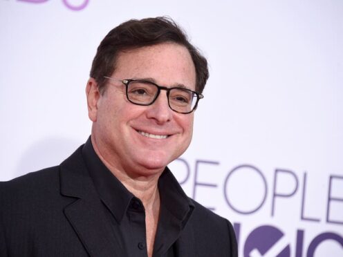 FILE – Bob Saget arrives at the People’s Choice Awards at the Microsoft Theater on Wednesday, Jan. 18, 2017, in Los Angeles. Saget, a comedian and actor known for his role as a widower raising a trio of daughters in the sitcom “Full House,” has died, according to authorities in Florida, Sunday, Jan. 9, 2022. He was 65. (Photo by Jordan Strauss/Invision/AP, File)