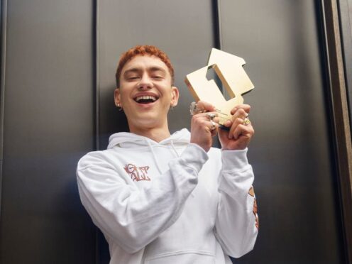 Olly Alexander of Years & Years with his award for reaching number one (Official Charts Company/PA)