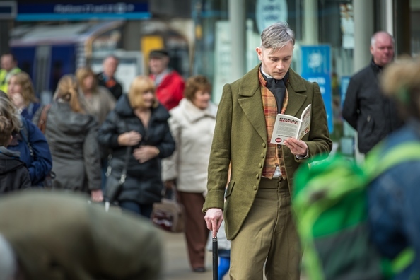 Sir Walter Scott (Fergus John McCann) reading the free Great Scott! book at Waverley Station c Chris Scott