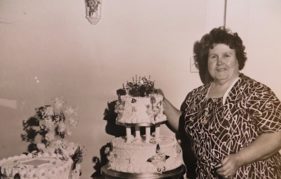 Mrs Thompson with two of the 2,000 wedding cakes she baked in her lifetime