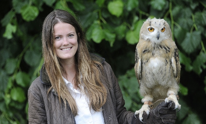 Rosie Drumm with a Siberian Eagle Owl chick at The Scottish Game Show