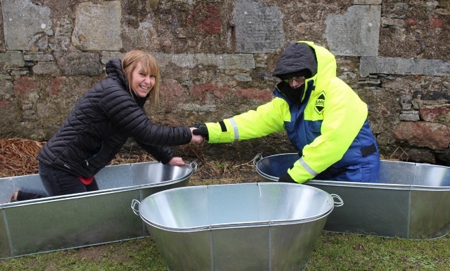 The tin baths are delivered to Hillswick Wildlife Sanctuary by Streamline's Lerwick sales manager, Gillian MacDonald
