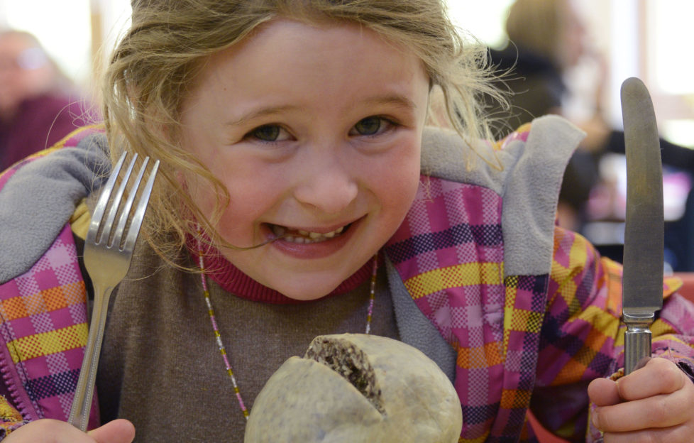 Five-year-old Sarah Burton from Spean Bridge tries out her award-winning haggis