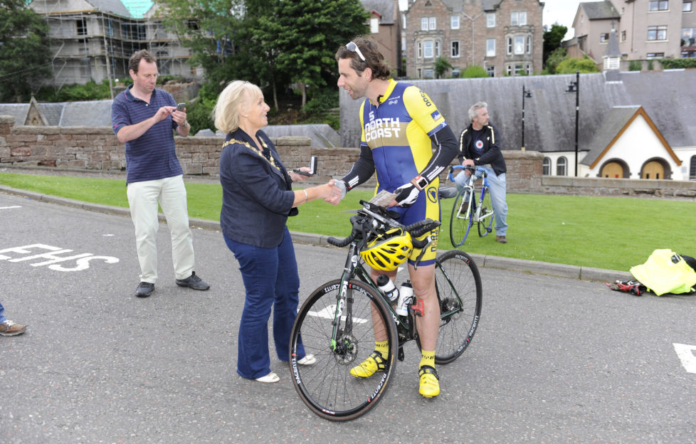 Mark receiving the Coin of Inverness from Provost Helen Carmichael Pic: Steve Arkley