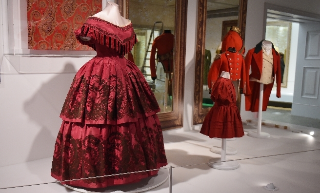 A few of the red outfits on display at A Century of Style: Costume and Colour 1800-1899. Photo copyright CSG CIC Glasgow Museums Collection