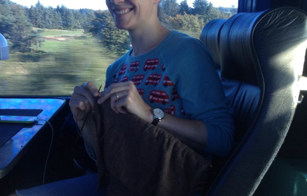 Sarah Champion (Dorabella) knitting on the tour bus