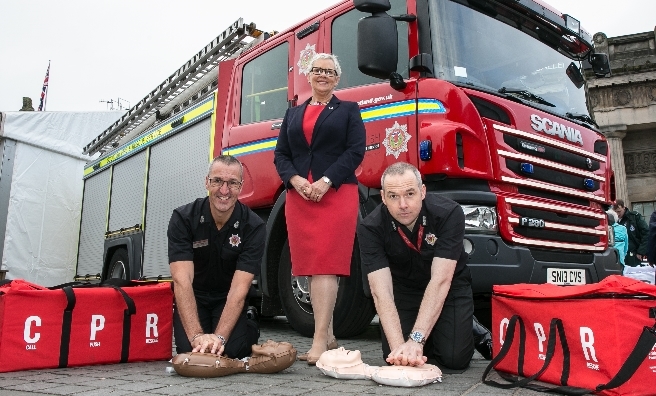 BHF's Catherine Kelly with Dave Boyle, Assistant Chief Officer/Director of Service Delivery, SFRS, and John Miller, station manager at Tollcross fire station