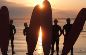 Sunset surfers in East Lothian, preparing for the surfing competition during the John Muir Outdoor Festival