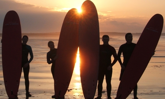 Sunset surfers in East Lothian, preparing for the surfing competition during the John Muir Outdoor Festival