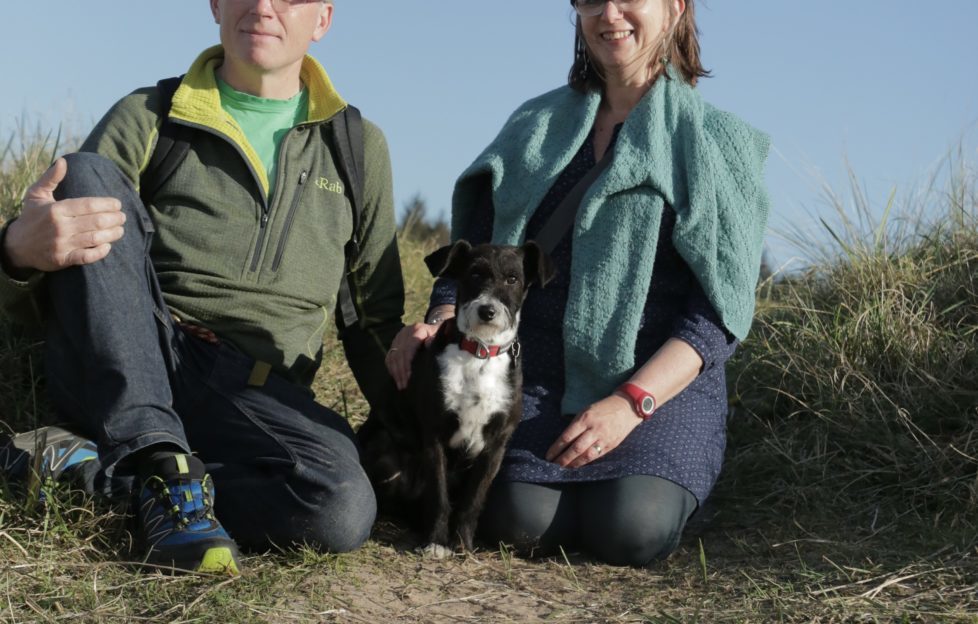 Cassie with owners Andy and Carol