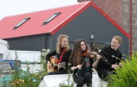 Oban High School students Emma Faird, Anna Garvin and Alastair MacLean at the official opening of the shelter. Pic by Tom Finnie