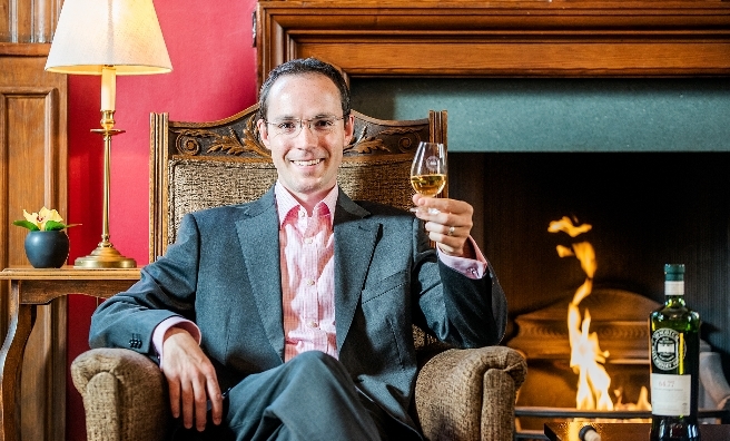 Slainte mhath! Dr Adam Moore relaxes with the whisky suggested by his personality.