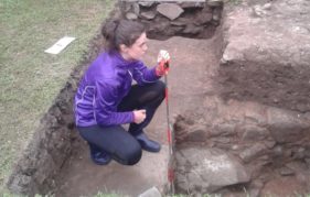 One of the Trailblazer volunteers records the medieval walls uncovered during the excavation.