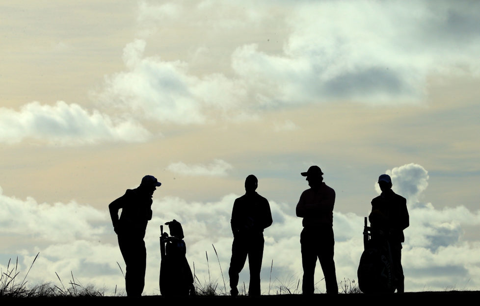 Ernie Els and Charl Schwartzel with their caddies on Carnoustie Championship during the 2013 Alfred Dunhill Links Championship. Photo by David Cannon/Getty Images