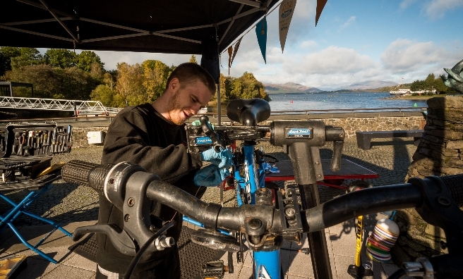 Fixing bikes at Loch Lomond Shores. Photo by Andy Catlin