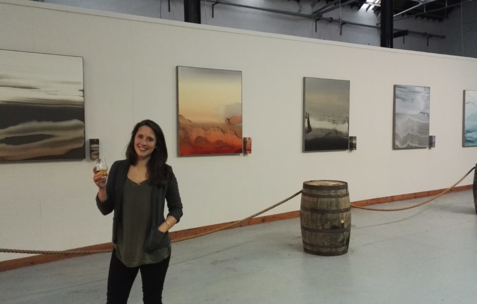 Eva Ullrich with the exhibition of her paintings in Tomatin Distillery
