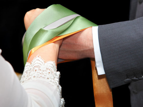 hand-tying Featured Image for The Meaning Behind Handfasting