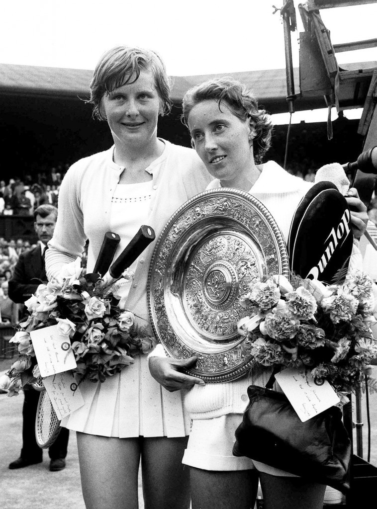 Beaten but smiling, Christine Truman puts a friendly arm around Angela Mortimer, first British winner of the title since 1937 (PA Archive)