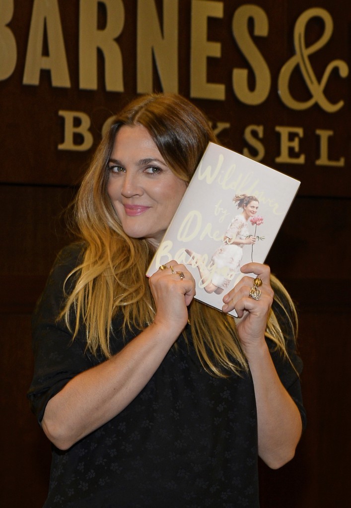 Drew Barrymore poses with her new book"Wildflower" (Photo by Kevork Djansezian/Getty Images)