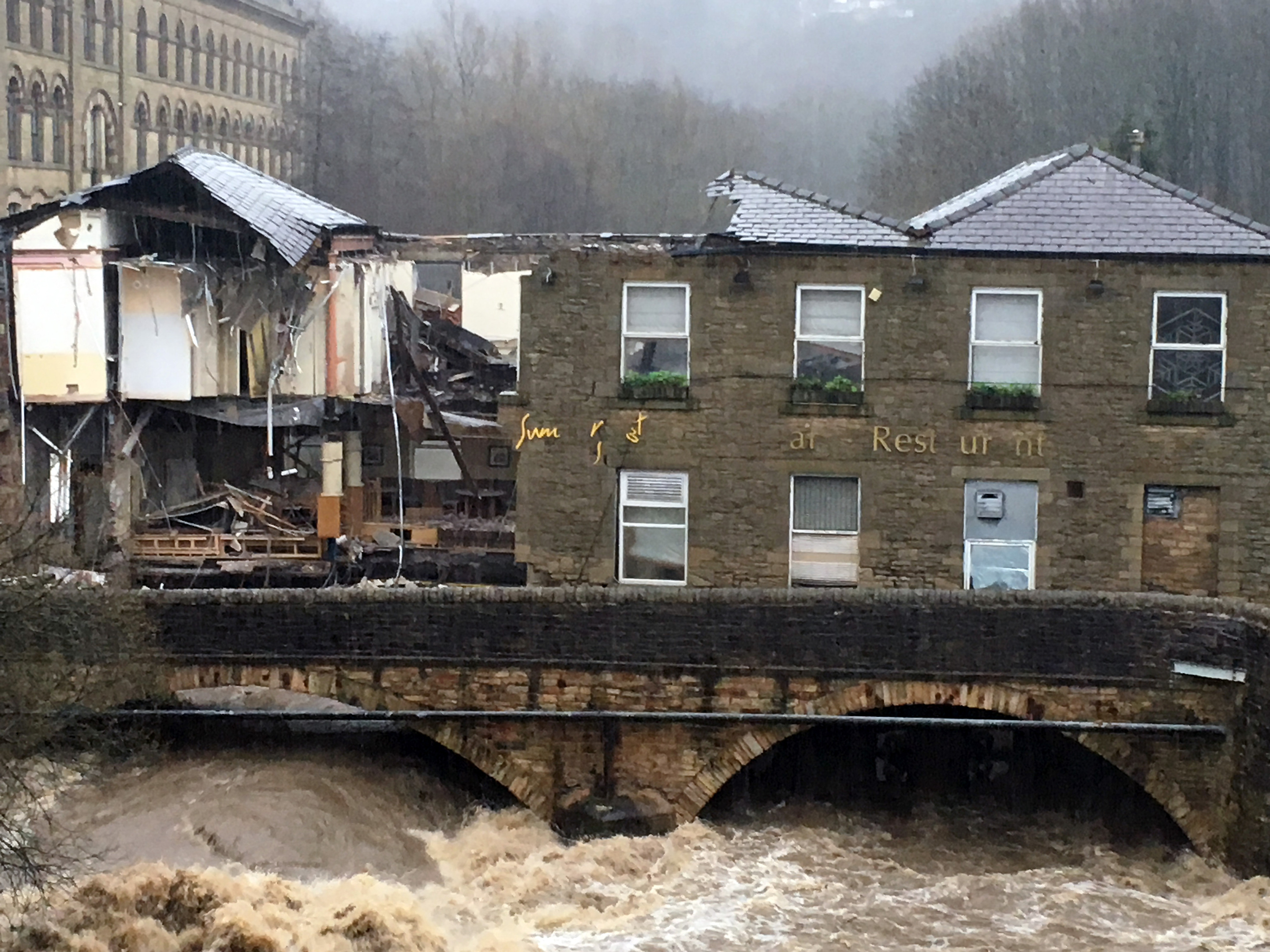 Waterside pub in Summerseat, Lancashire, which partially collapsed due to flooding in the River Irwell.  (Neil Hughes / PA Wire)