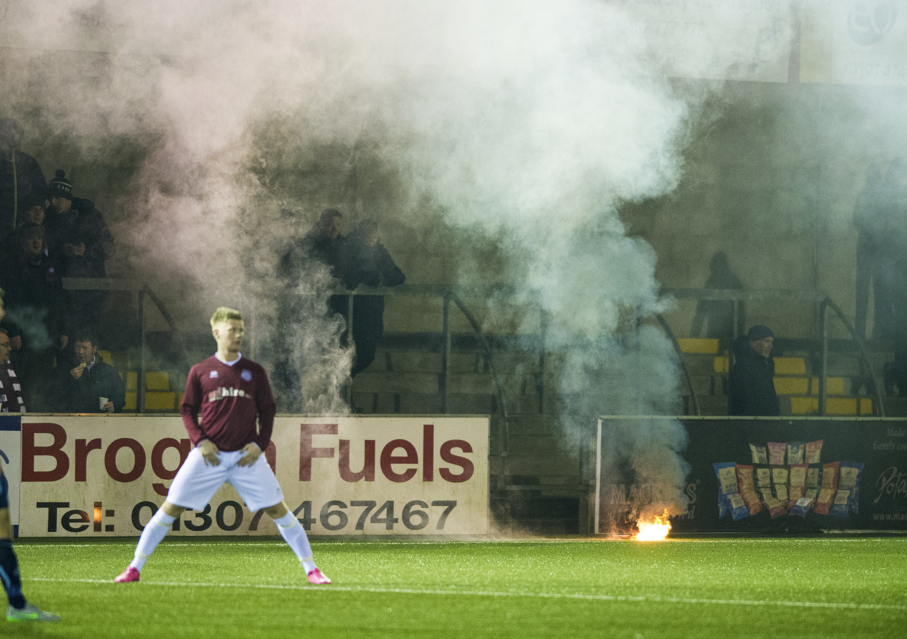 Flares are thrown onto the pitch at Forfar (Ross Parker / SNS Group)