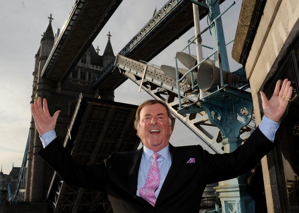 Sir Terry Wogan celebrating being given the Freedom of the City of London by single-handedly raising Tower Bridge (Stefan Rousseau/PA Wire)