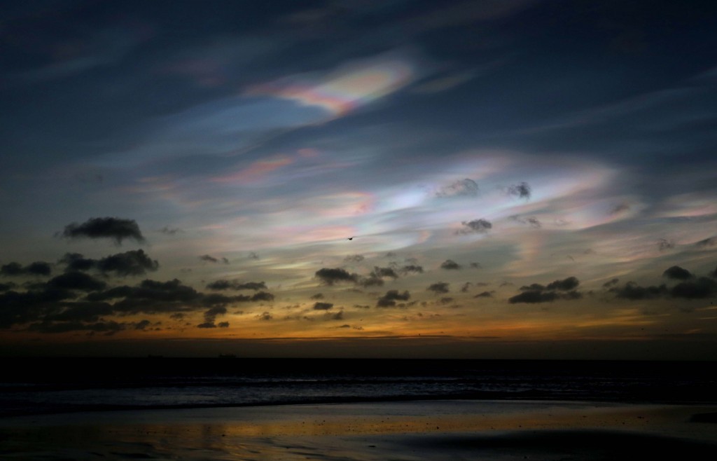 Rare Nacreous clouds on the coastline of Northumberland (Owen Humphreys/PA Wire)