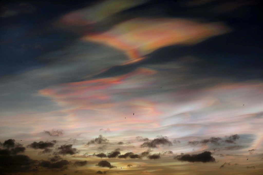 Rare Nacreous clouds on the coastline of Northumberland (Owen Humphreys/PA Wire)