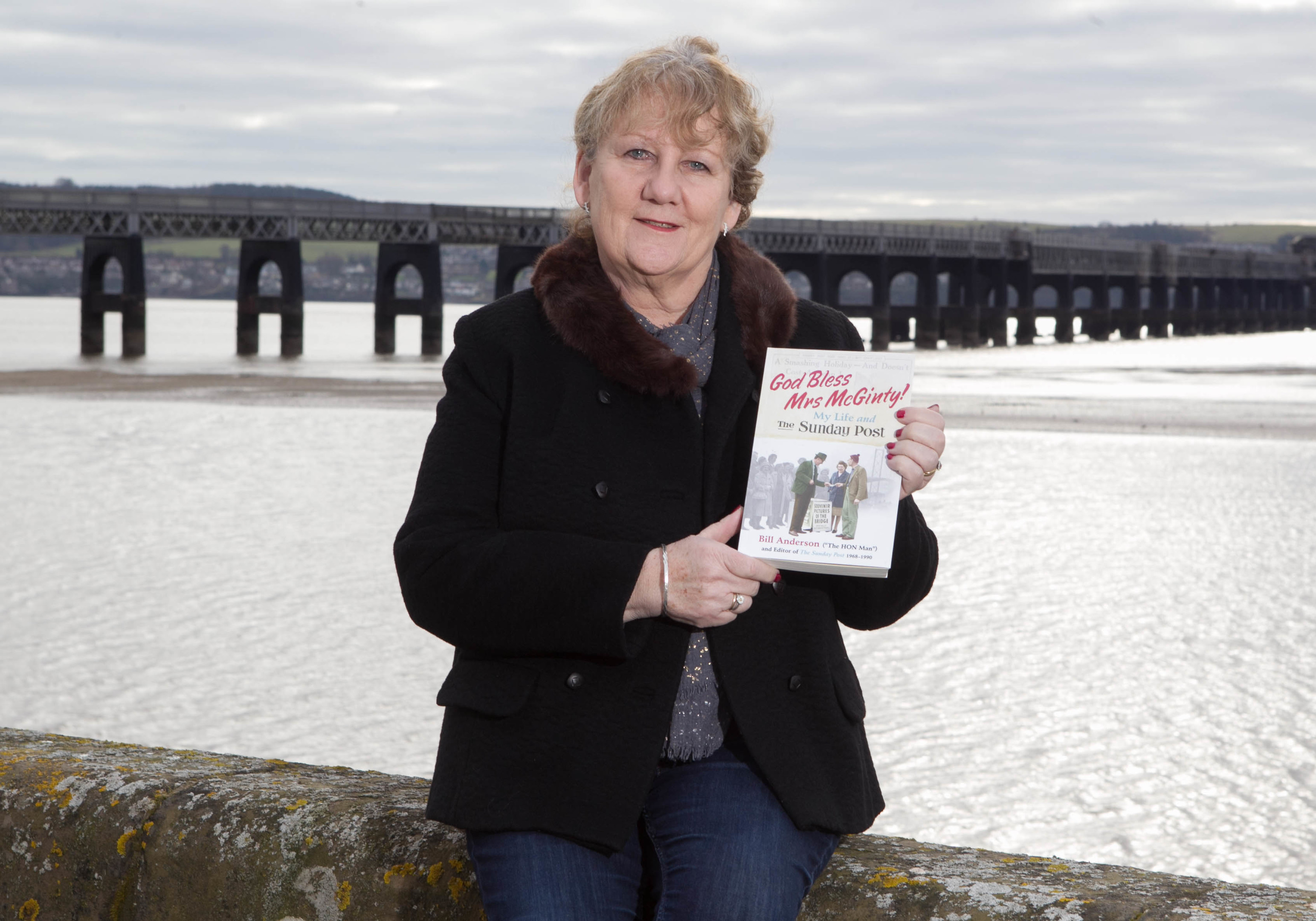 Maggie Anderson, widow of former Sunday Post Editor Bill Anderson, holds a copy of Bill's book (Chris Austin/ Sunday Post)