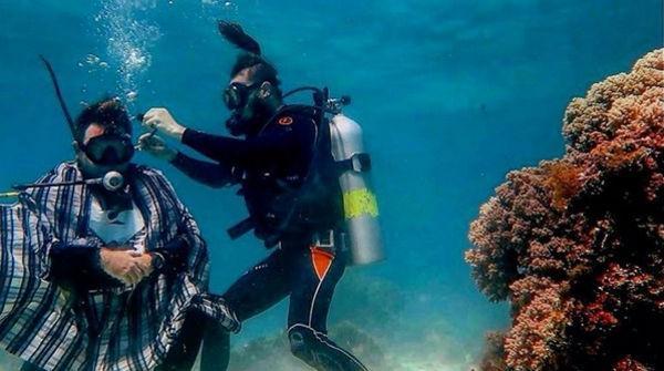 Russian barber Dennis Yushin has cut clients' hair underwater