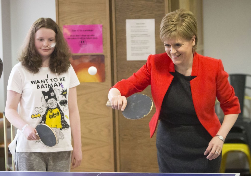 First Minister Nicola Sturgeon plays table tennis with patient Erin Campbell during a visit to the Royal Hospital for Sick Children in Glasgow today (Danny Lawson/PA Wire)