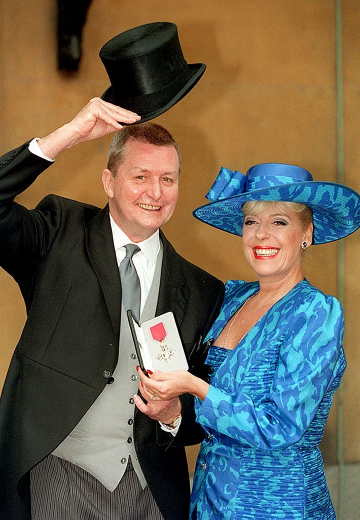 Tony with actress Julie Goodyear outside Buckingham Palace after he received an MBE (Martin Keene/PA Wire)