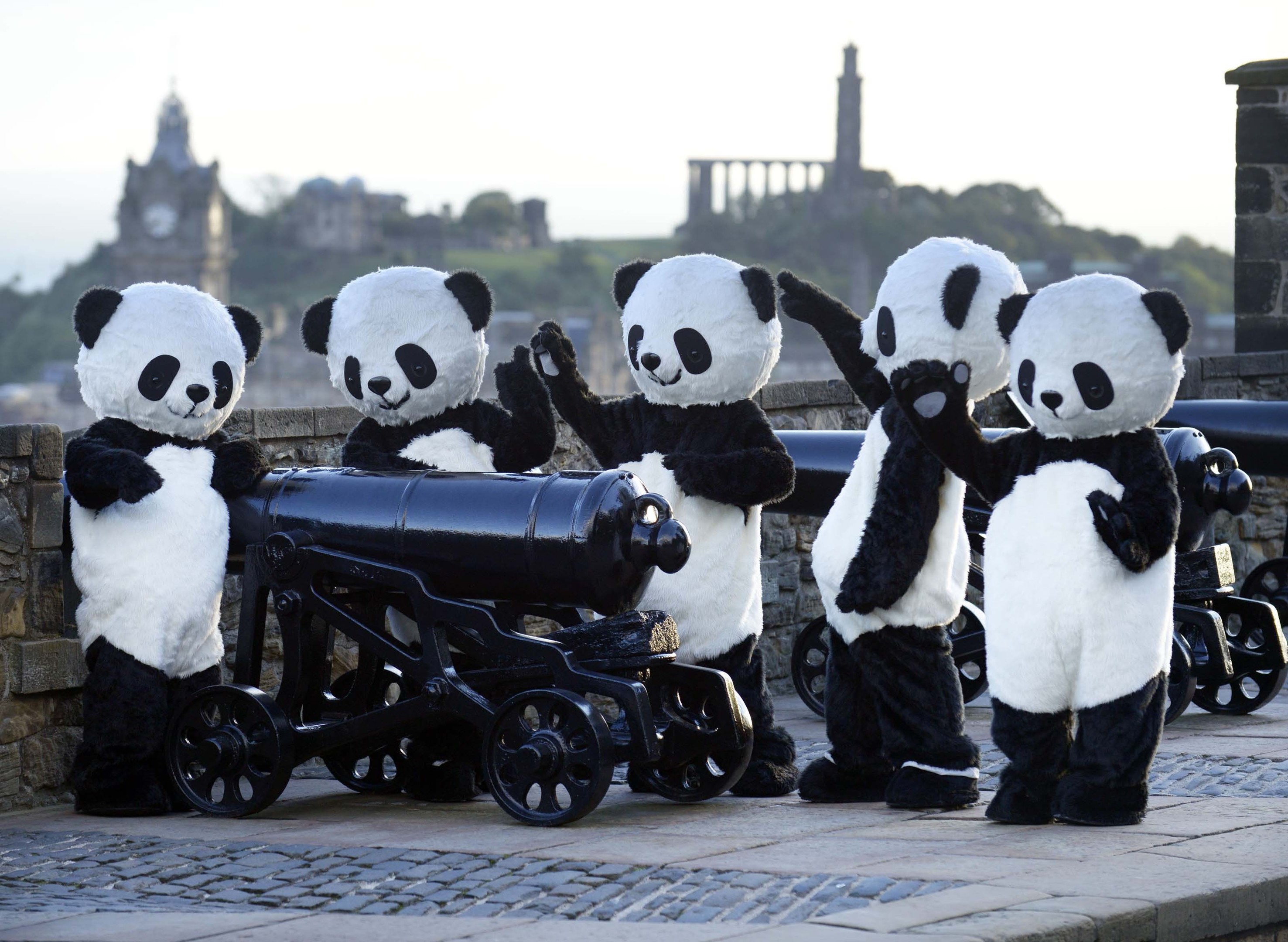 Performers in panda costumes at Edinburgh Castle, Scotland to highlight the launch of a Europe-wide search for a group of Panda Ambassadors to win the chance to visit Chengdu Panda Base in China and work on a conservation project (PA)