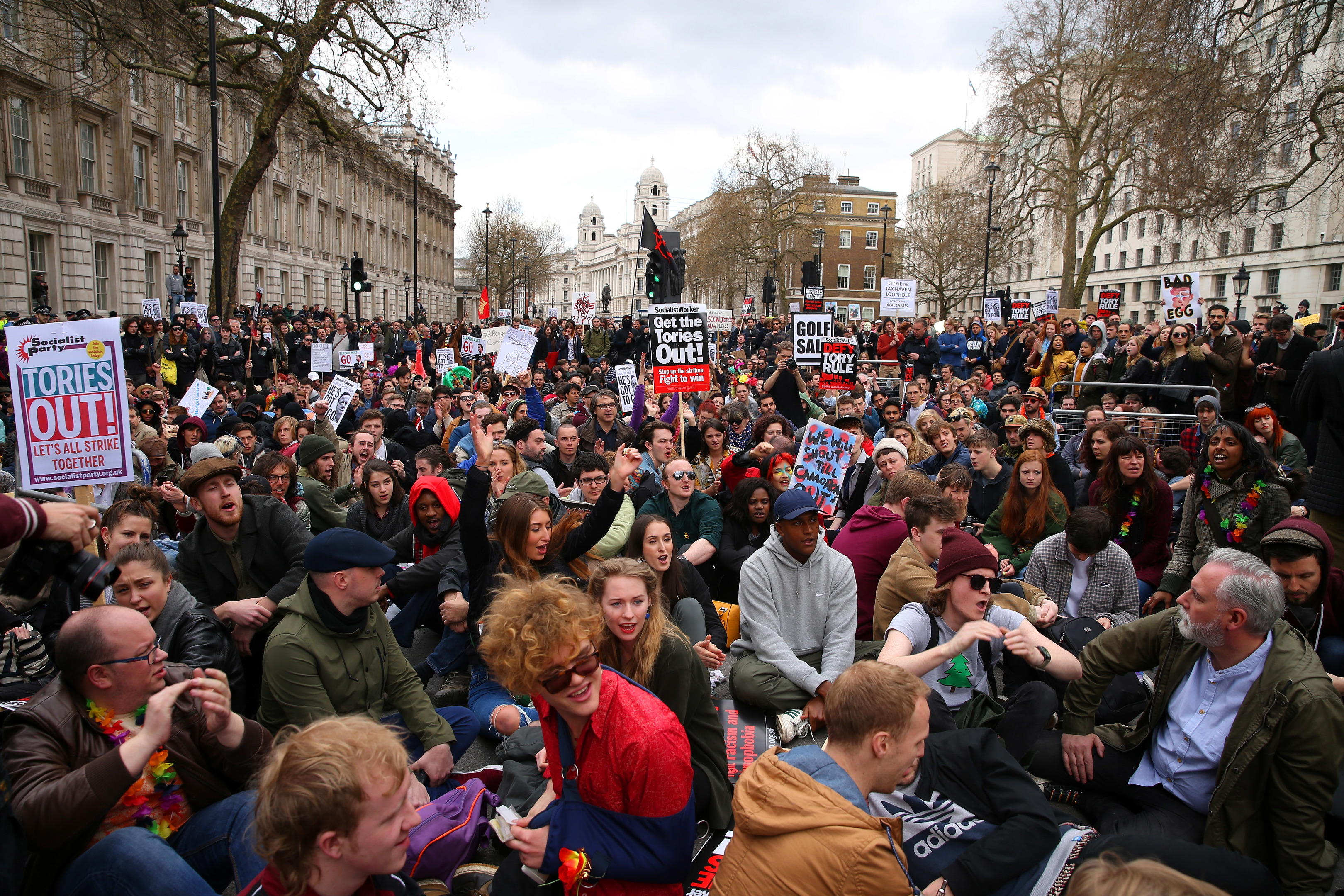 Demonstrators sit down in protest outside Downing Street (Dan Kitwood/Getty Images)