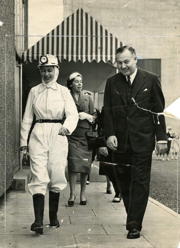 Far from the usual smart skirts and jackets the Queen is dressed in protective clothing during a visit to Rothes Colliery in June, 1958 (DC Thomson)