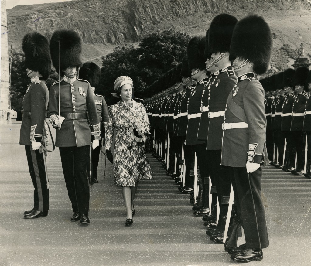 The Queen inspects the impressive guard of honour, the 2nd Battalion Scots Guards, at Holyrood in 1974. Note the slopes of Arthur’s Seat in the background (DC Thomson)