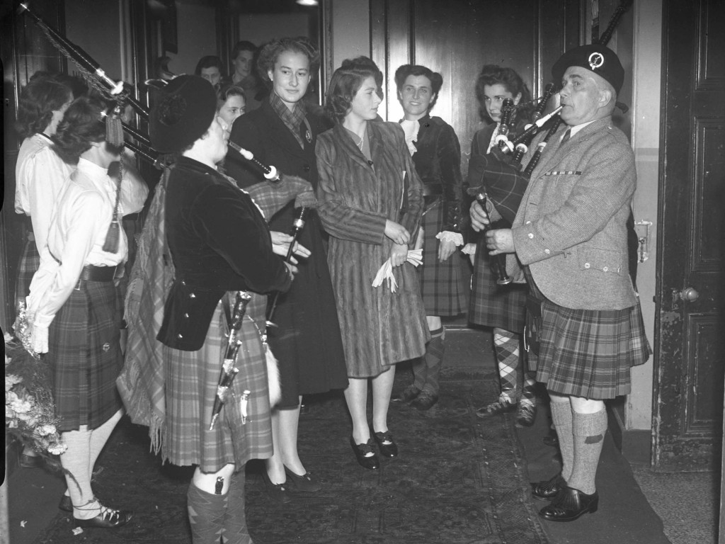 The Princess looks on as a pair of pipers belt out some tunes in 1945. It’s hard to tell from the young royal’s face if she’s a fan of the skirl or not (DC Thomson)