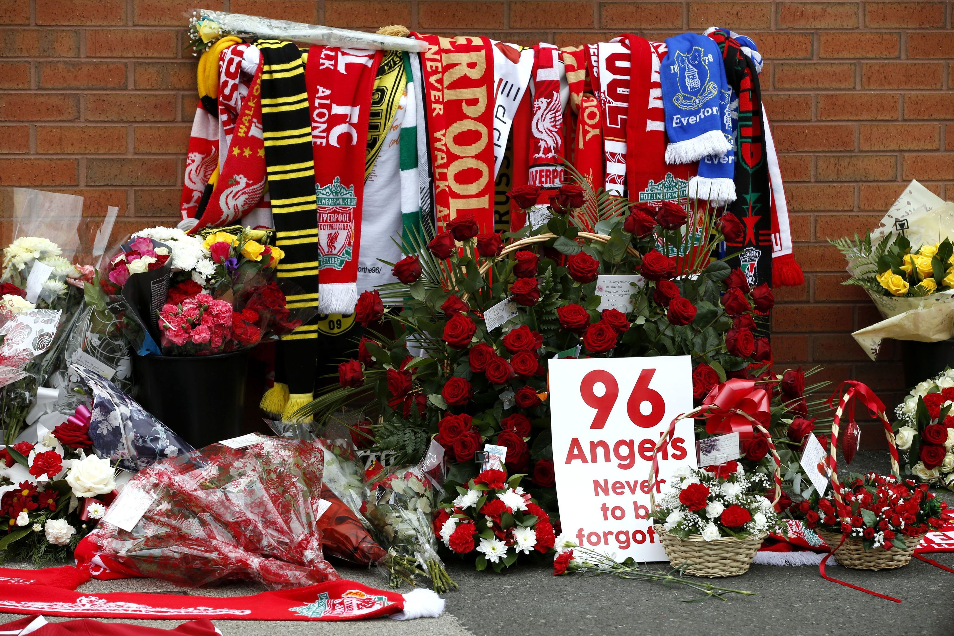 Flowers are placed at the Hillsborough memorial (Peter Byrne/PA Wire)