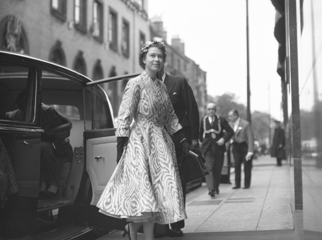 1955: The Queen exits an official car on a visit to Templeton's Factory in Glasgow (Pic: DC Thomson)