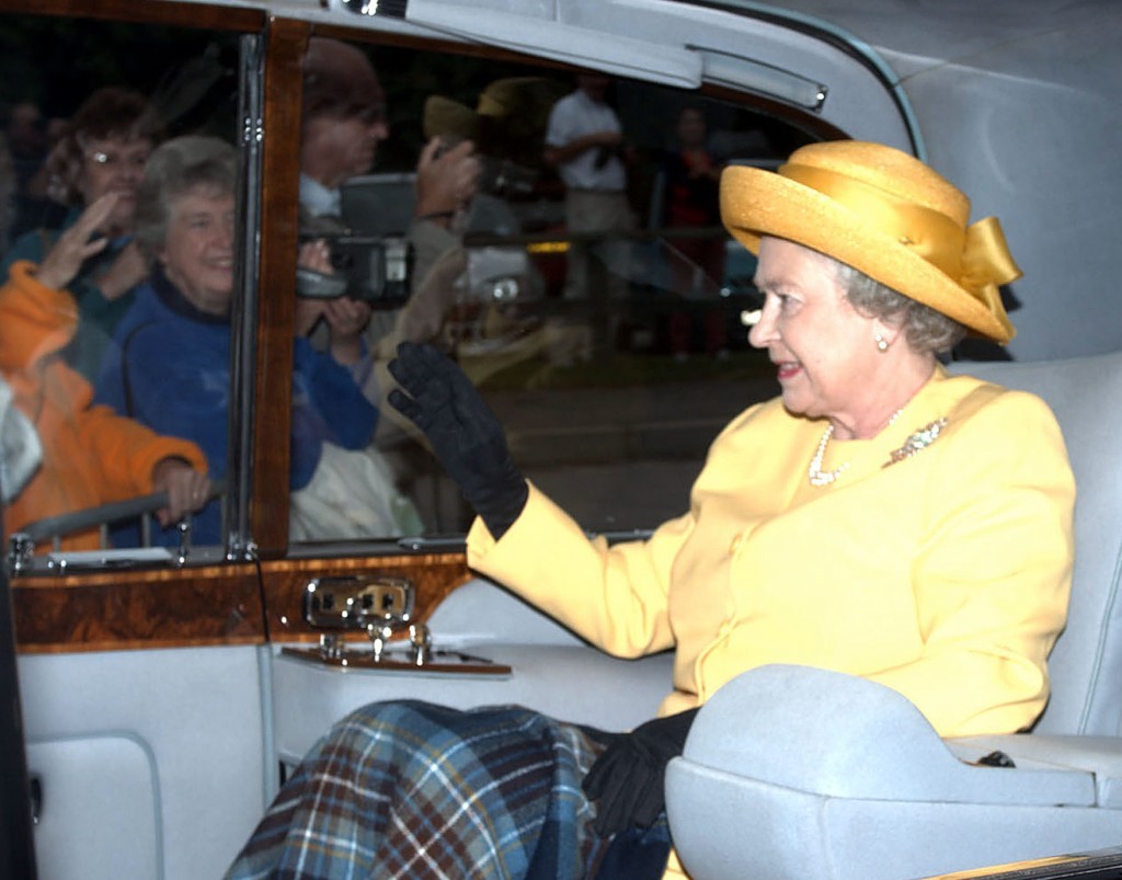 Queen Elizabeth waves to wellwishers as she arrives at Crathie Church at Balmoral (PA Archive)